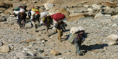 Migrant workers return to the western hills of Nepal from India. This photo was taken in Bajura.